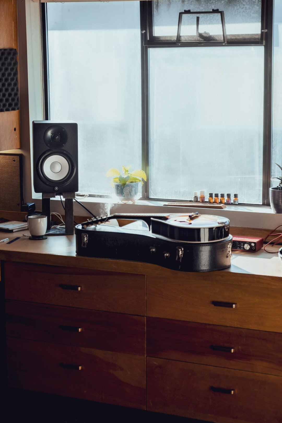 Home recording studio with mixing console and instruments