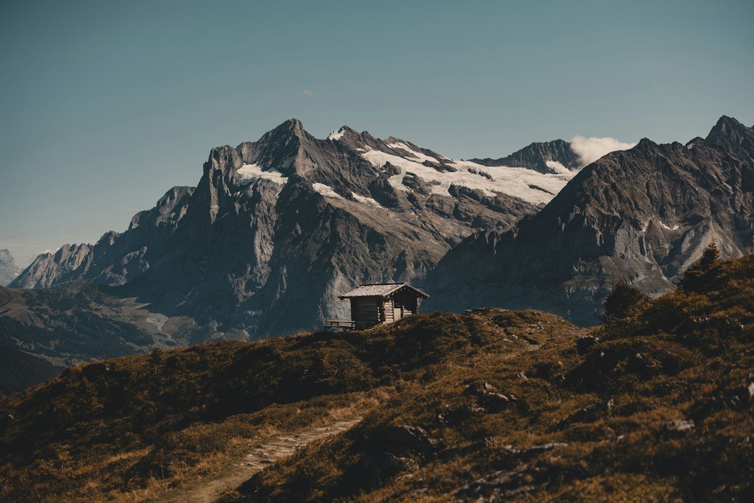 Swiss alpine chalet exterior surrounded by mountains